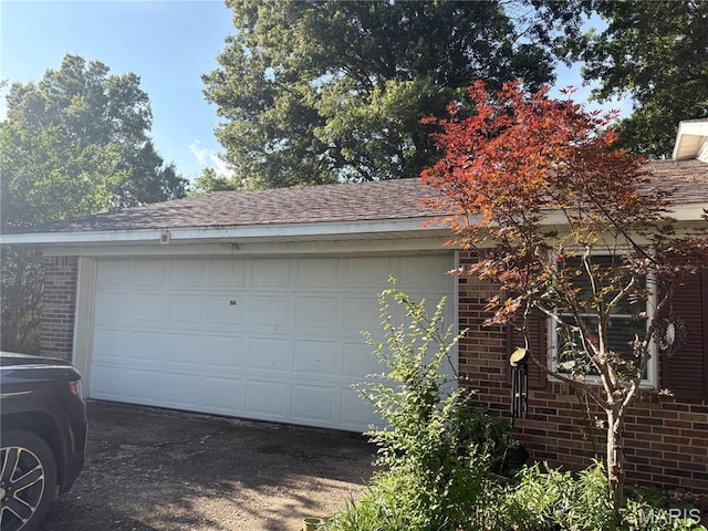 305 Manor, Steele, MO 63877 - garage with concrete driveway