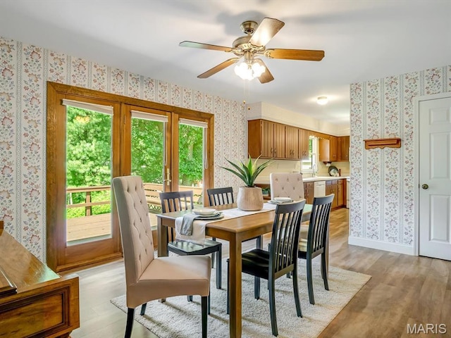 1471 Ladd Ave, Edwardsville, IL 62025 - dining space with wallpapered walls, light wood finished floors, plenty of natural light, and a ceiling fan