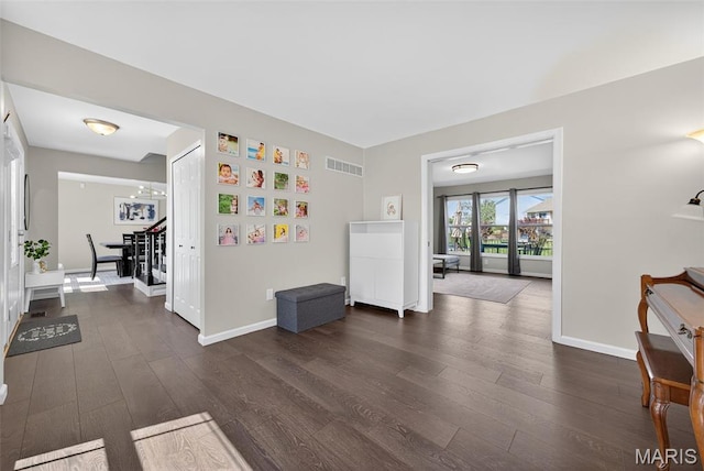153 Dusty Rose Dr, Ofallon, MO 63368 - foyer with dark wood-style floors and baseboards