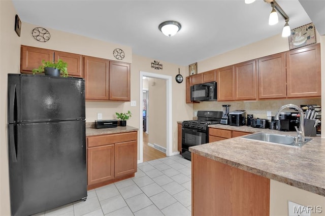 22 Green Acres Rd, Bellefontaine Nghbrs, MO 63137 - kitchen featuring black appliances, light tile patterned floors, light countertops, and brown cabinets