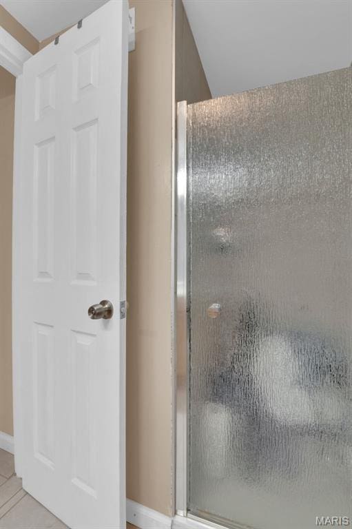 22 Green Acres Rd, Bellefontaine Nghbrs, MO 63137 - bathroom with tile patterned floors and an enclosed shower