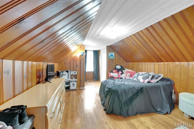22 Green Acres Rd, Bellefontaine Nghbrs, MO 63137 - bedroom with wood walls, vaulted ceiling, and wood-type flooring