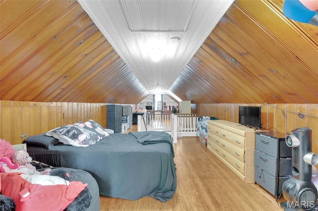 22 Green Acres Rd, Bellefontaine Nghbrs, MO 63137 - bedroom with wood walls, wood finished floors, and vaulted ceiling