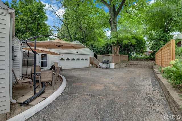 22 Green Acres Rd, Bellefontaine Nghbrs, MO 63137 - view of patio with an outbuilding, grilling area, and a detached garage