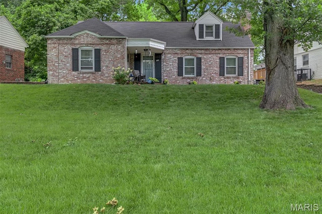 22 Green Acres Rd, Bellefontaine Nghbrs, MO 63137 - new england style home with brick siding and a front yard