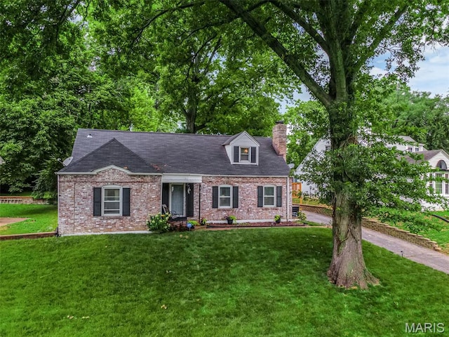 22 Green Acres Rd, Bellefontaine Nghbrs, MO 63137 - cape cod home with a chimney, a front lawn, and brick siding