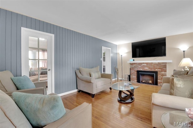 22 Green Acres Rd, Bellefontaine Nghbrs, MO 63137 - living area with wood finished floors and a fireplace