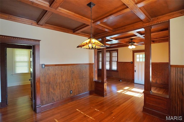 130 E 2nd St, Hermann, MO 65041 - unfurnished room with a wainscoted wall, coffered ceiling, wood finished floors, a ceiling fan, and beamed ceiling