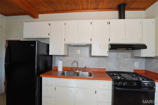 130 E 2nd St, Hermann, MO 65041 - kitchen with black appliances, under cabinet range hood, wooden ceiling, decorative backsplash, and white cabinets