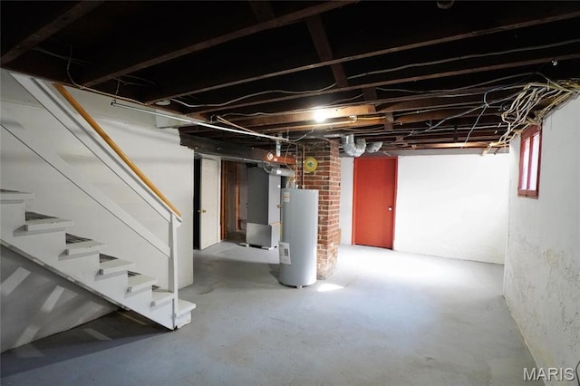 130 E 2nd St, Hermann, MO 65041 - below grade area featuring water heater, stairs, and heating unit