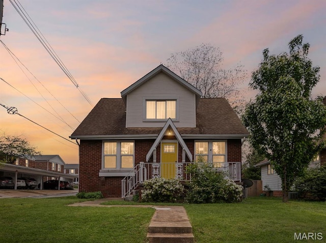 14 S 87th St, Belleville, IL 62223 - view of front facade featuring brick siding and a lawn