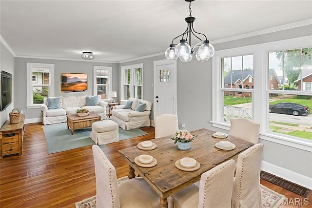14 S 87th St, Belleville, IL 62223 - dining room with crown molding, wood finished floors, and a chandelier