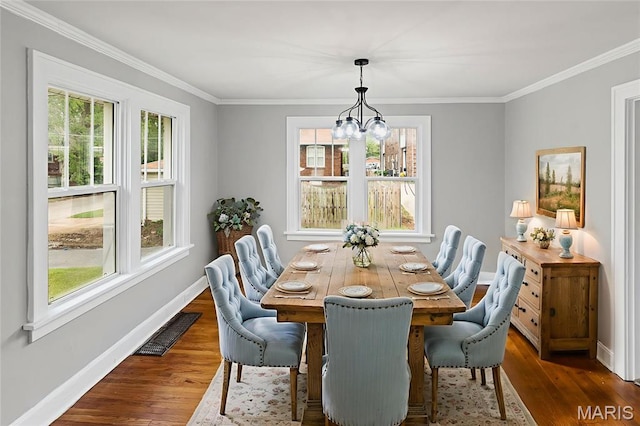 14 S 87th St, Belleville, IL 62223 - dining space featuring a chandelier, dark wood finished floors, and ornamental molding