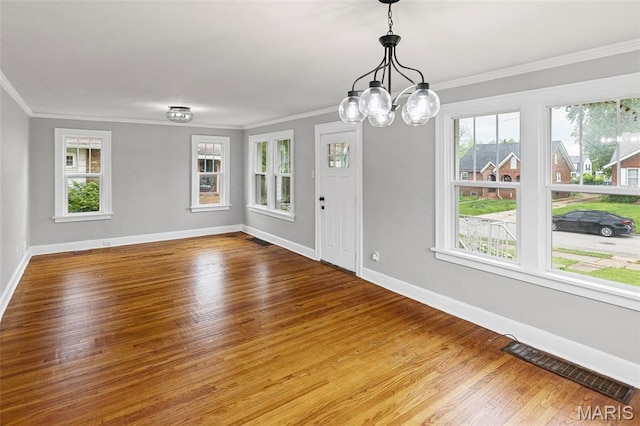 14 S 87th St, Belleville, IL 62223 - spare room with crown molding, wood finished floors, and a chandelier