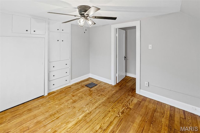 14 S 87th St, Belleville, IL 62223 - unfurnished bedroom featuring light wood-style floors, ceiling fan, and a closet