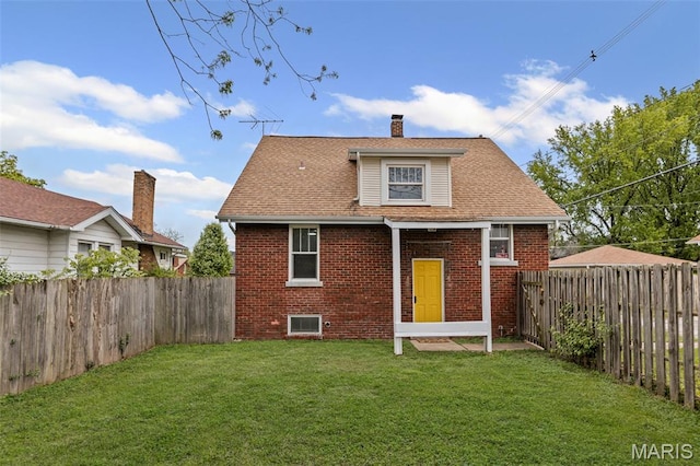 14 S 87th St, Belleville, IL 62223 - rear view of house with brick siding, a fenced backyard, a chimney, and roof with shingles