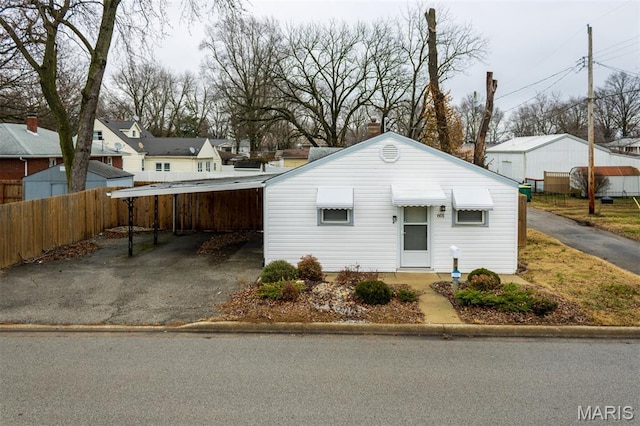 601 E Jefferson St, Ofallon, IL 62269 - bungalow-style house featuring a detached carport, a residential view, and driveway