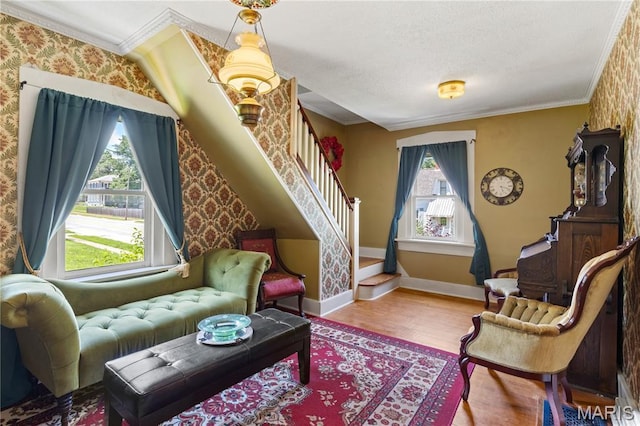 549 E 9th St, Alton, IL 62002 - living area with crown molding, wood finished floors, stairs, and wallpapered walls