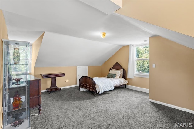 549 E 9th St, Alton, IL 62002 - carpeted bedroom with vaulted ceiling and baseboards