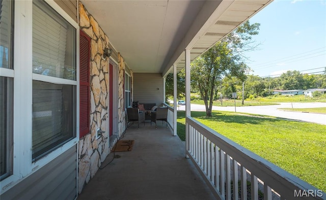 305 Pine Tree Rd, Rolla, MO 65401 - porch featuring a lawn