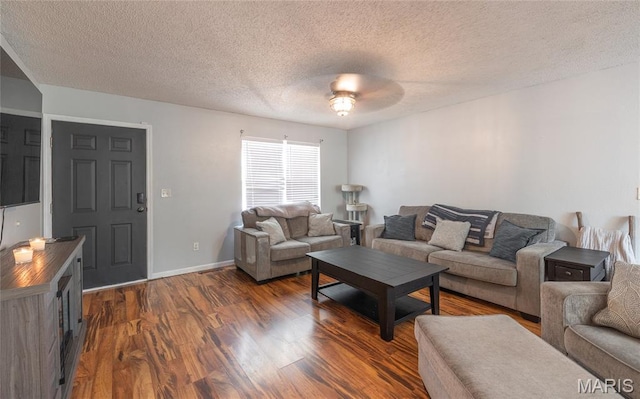 305 Pine Tree Rd, Rolla, MO 65401 - living room featuring dark wood-style floors, a textured ceiling, and a ceiling fan
