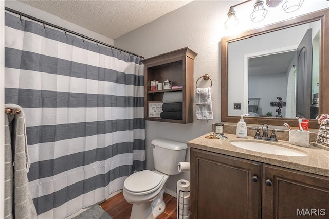 305 Pine Tree Rd, Rolla, MO 65401 - full bathroom with a textured ceiling, vanity, wood finished floors, and curtained shower