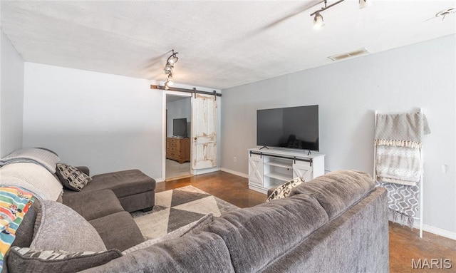 305 Pine Tree Rd, Rolla, MO 65401 - living room featuring a barn door and rail lighting