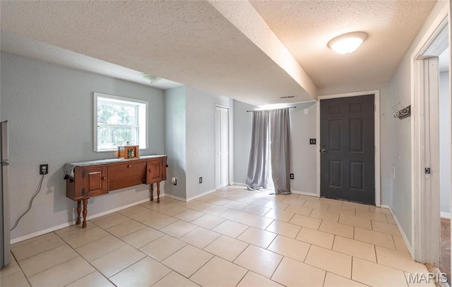 305 Pine Tree Rd, Rolla, MO 65401 - entrance foyer featuring a textured ceiling and light tile patterned floors