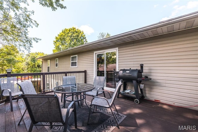 305 Pine Tree Rd, Rolla, MO 65401 - wooden deck with area for grilling and outdoor dining area