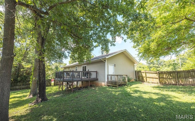 305 Pine Tree Rd, Rolla, MO 65401 - back of property featuring a deck and a fenced backyard