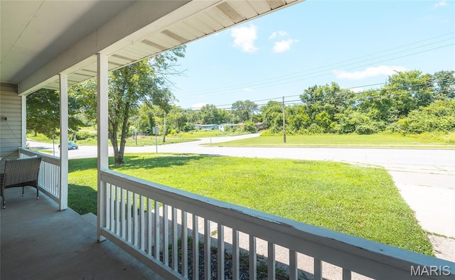 305 Pine Tree Rd, Rolla, MO 65401 - covered porch featuring a yard and view of wooded area