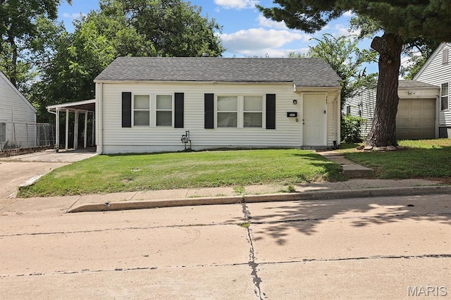 345 Mueller Ave, Ferguson, MO 63135 - bungalow-style house with concrete driveway and roof with shingles