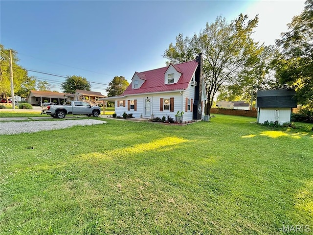 1409 S Washington St, Salem, MO 65560 - new england style home with a chimney, a shed, a front lawn, a metal roof, and driveway