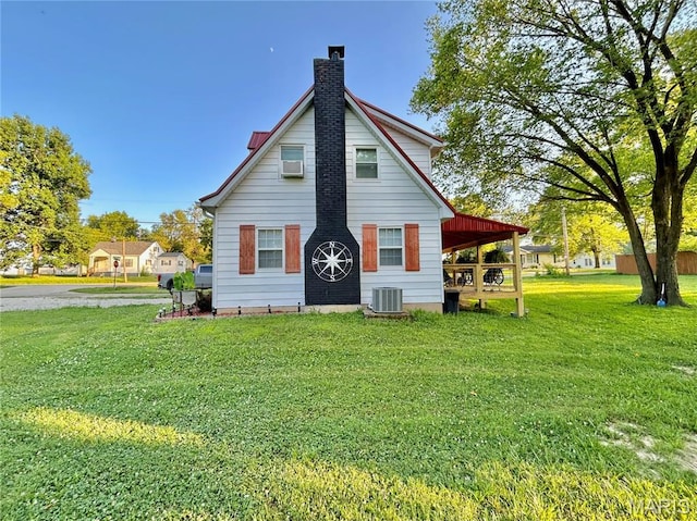 1409 S Washington St, Salem, MO 65560 - view of front of home with a front lawn and a chimney