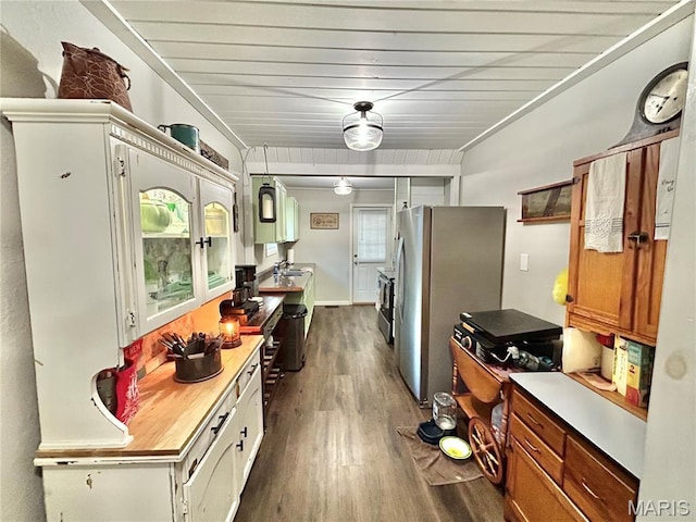 1409 S Washington St, Salem, MO 65560 - kitchen with freestanding refrigerator, dark wood-style floors, brown cabinets, and light countertops