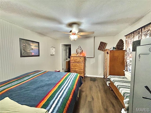 1409 S Washington St, Salem, MO 65560 - bedroom with wood finished floors, a textured ceiling, and a ceiling fan