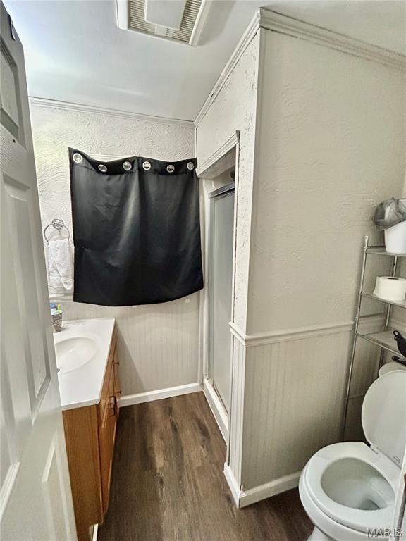 1409 S Washington St, Salem, MO 65560 - full bath with a shower stall, wood finished floors, and vanity