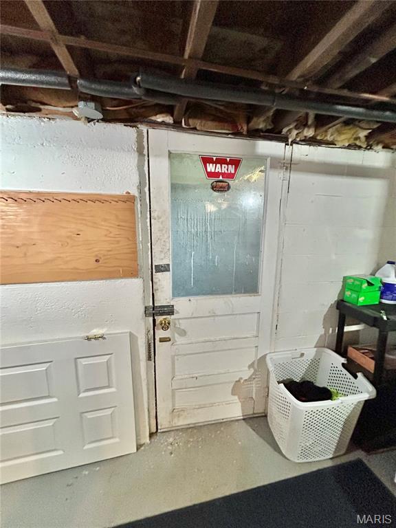 1409 S Washington St, Salem, MO 65560 - unfinished basement with concrete block wall