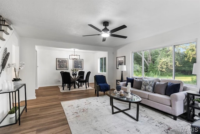 911 Cordova St, Saint Ferdinand Township, MO 63138 - living area featuring wood finished floors, ceiling fan, a chandelier, and a textured ceiling