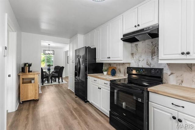911 Cordova St, Saint Ferdinand Township, MO 63138 - kitchen featuring black appliances, under cabinet range hood, wood counters, and white cabinets