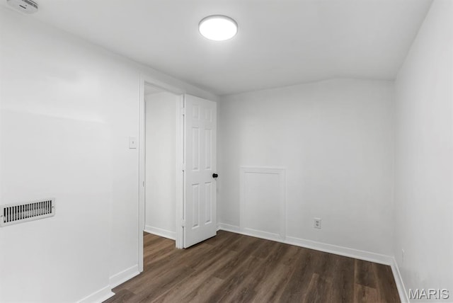 911 Cordova St, Saint Ferdinand Township, MO 63138 - spare room featuring dark wood-style flooring and vaulted ceiling