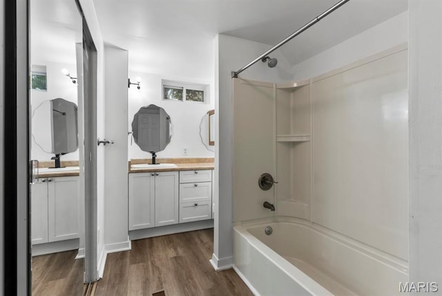 911 Cordova St, Saint Ferdinand Township, MO 63138 - bathroom featuring shower / bathtub combination, wood finished floors, and vanity