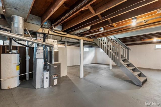 911 Cordova St, Saint Ferdinand Township, MO 63138 - below grade area with water heater, stairway, and heating unit