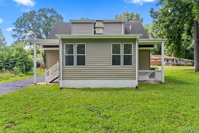 911 Cordova St, Saint Ferdinand Township, MO 63138 - view of side of property featuring a lawn, a shingled roof, a porch, and driveway
