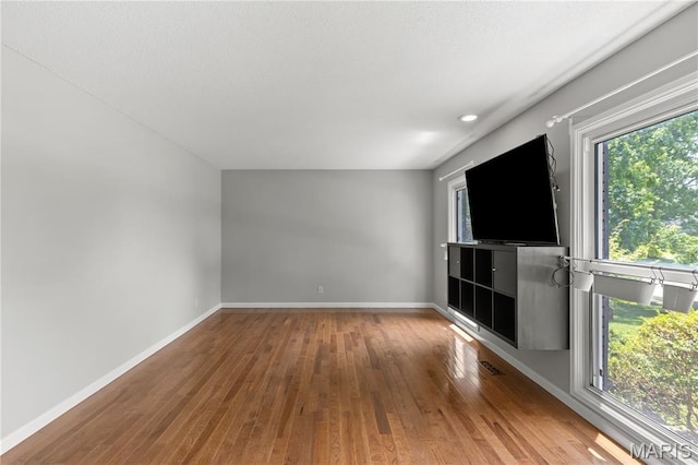 502 Lalor Dr, Manchester, MO 63011 - unfurnished living room with hardwood / wood-style floors and baseboards