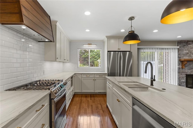 502 Lalor Dr, Manchester, MO 63011 - kitchen featuring stainless steel appliances, premium range hood, backsplash, light stone counters, and recessed lighting
