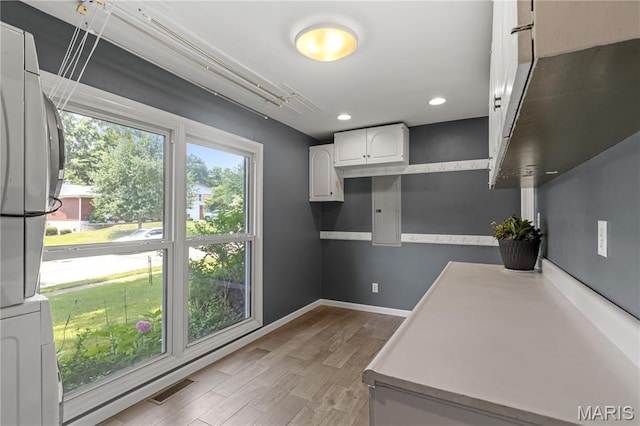502 Lalor Dr, Manchester, MO 63011 - kitchen with white cabinetry, light wood-type flooring, light countertops, and recessed lighting