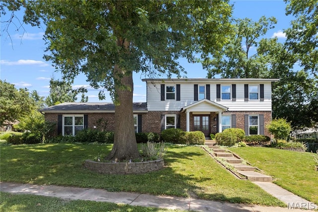 502 Lalor Dr, Manchester, MO 63011 - traditional-style house with brick siding and a front lawn