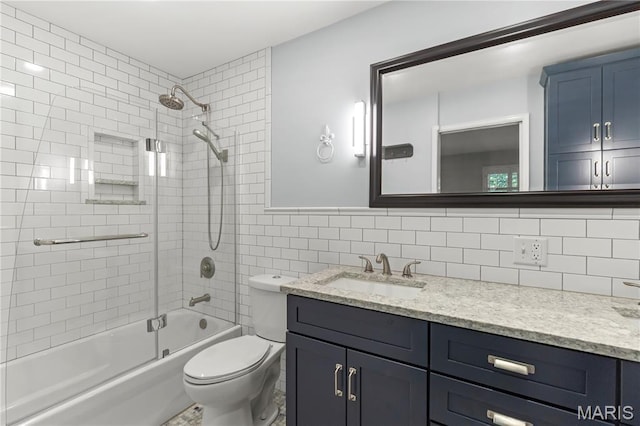 502 Lalor Dr, Manchester, MO 63011 - full bathroom featuring vanity, shower / washtub combination, backsplash, and tile walls