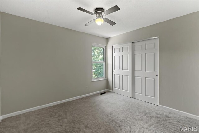 502 Lalor Dr, Manchester, MO 63011 - unfurnished bedroom with carpet flooring, a closet, and ceiling fan